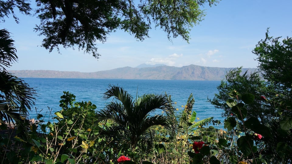 Laguna de Apoyo, a giant carter lake that formed after a volcano imploded on itself. You can see smoking Mombacho Volcano in the background.