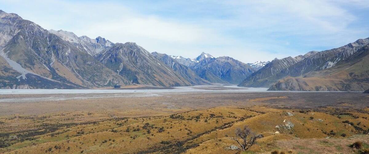 Lord of the Rings country! From the rocky outcrop of Mount Sunday (used as the location of Edoras - home of the Rohan) there's a 360-degree view of the Southern Alps.
This was a highlight of our trip to New Zealand and is an easy walk from the Mount Sunday car park. The "Mount" itself is more of a hill really so don't be put off! Access is via a long, gravel track off State Highway 72 at Mount Somers (signposted Mt Potts).
Whether you're a LOTR fan or not, if you enjoy raw, spectacular scenery you shouldn't miss it.
Read more at http://www.aboveusonlyskies.com/mount-sunday-rohan/