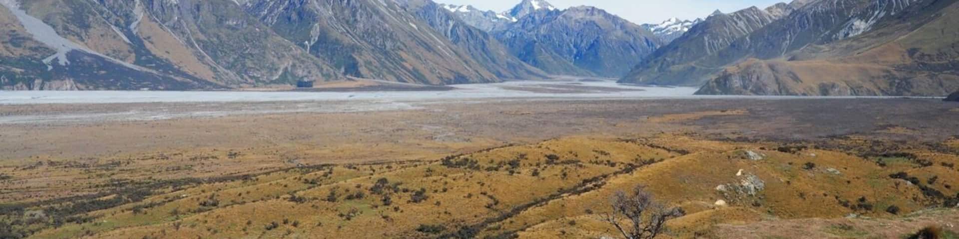 Lord of the Rings country! From the rocky outcrop of Mount Sunday (used as the location of Edoras - home of the Rohan) there's a 360-degree view of the Southern Alps.
This was a highlight of our trip to New Zealand and is an easy walk from the Mount Sunday car park. The "Mount" itself is more of a hill really so don't be put off! Access is via a long, gravel track off State Highway 72 at Mount Somers (signposted Mt Potts).
Whether you're a LOTR fan or not, if you enjoy raw, spectacular scenery you shouldn't miss it.
Read more at http://www.aboveusonlyskies.com/mount-sunday-rohan/
