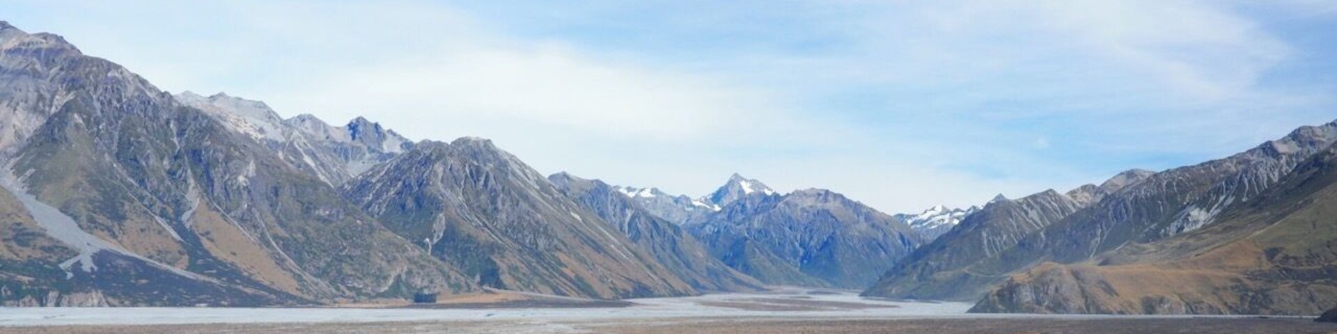 Lord of the Rings country! From the rocky outcrop of Mount Sunday (used as the location of Edoras - home of the Rohan) there's a 360-degree view of the Southern Alps.
This was a highlight of our trip to New Zealand and is an easy walk from the Mount Sunday car park. The "Mount" itself is more of a hill really so don't be put off! Access is via a long, gravel track off State Highway 72 at Mount Somers (signposted Mt Potts).
Whether you're a LOTR fan or not, if you enjoy raw, spectacular scenery you shouldn't miss it.
Read more at http://www.aboveusonlyskies.com/mount-sunday-rohan/
