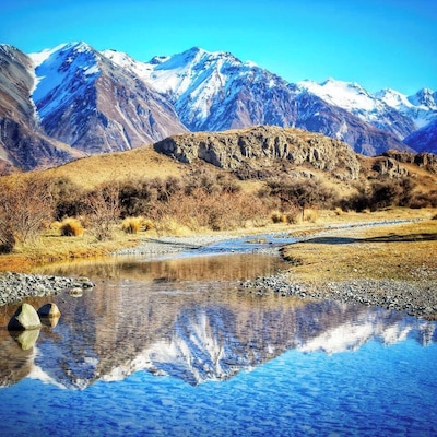 Mt. Sunday which you might recognize as Edoras in the Lord of the Rings - took them 11 months to build the set here, absolutely epic place! It's a 2.5 hr drive from Christchurch down gravel roads, usually ok in a regular 2WD car with an 1.5 hour return hike to the summit. Absolutely stunning, best visited in winter when there's snow on the mountains. It's a couple minutes past Mt. Potts Station where you can dine or sleep, no phone service anywhere near here