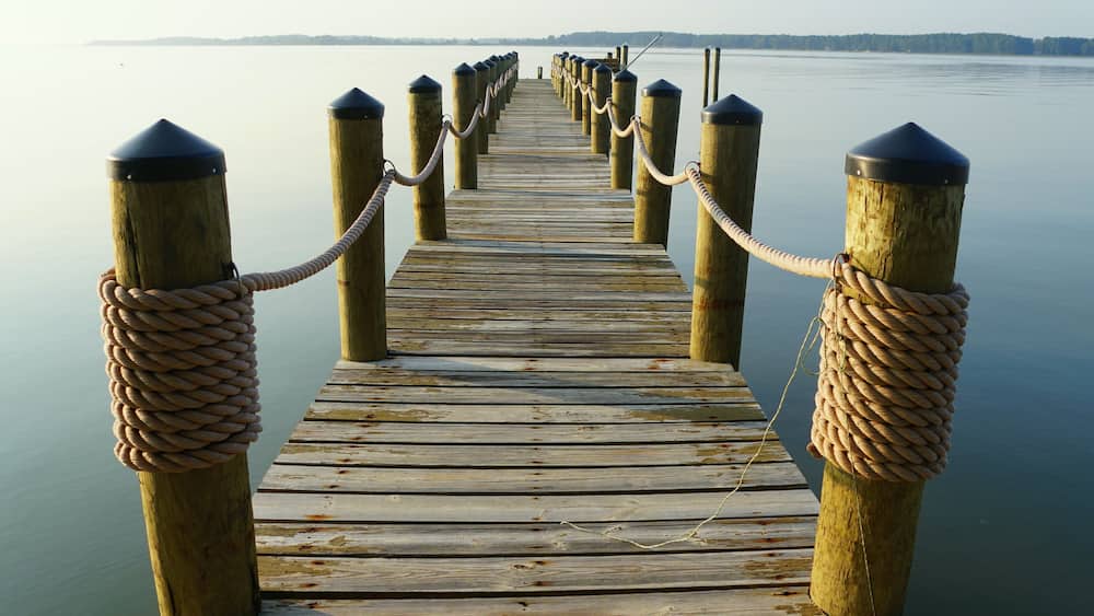 Wooden dock with ropes of a waterfront property at near Kinsale, Virginia, U.S.A