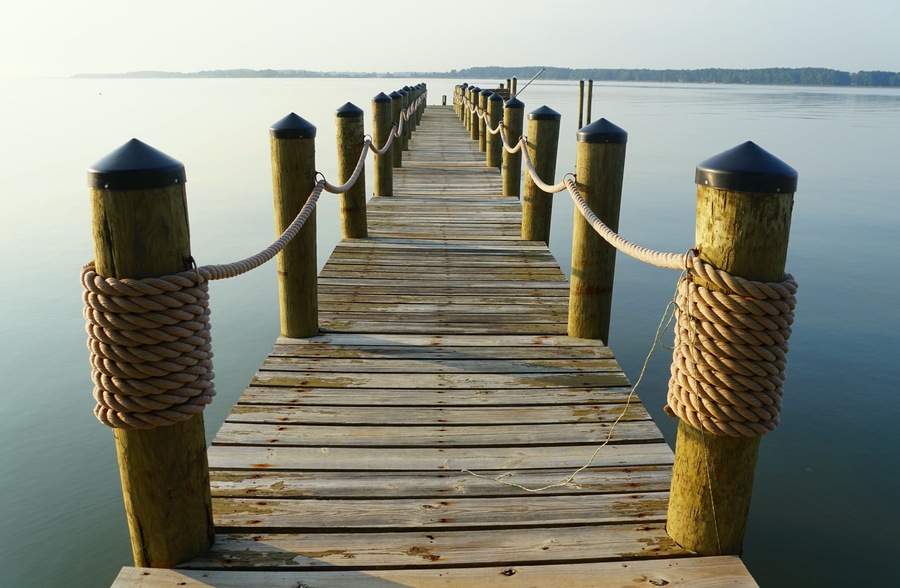 Wooden dock with ropes of a waterfront property at near Kinsale, Virginia, U.S.A