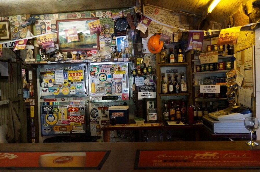 The Lion’s Den Hotel is the stop for a well-earned beer after completing the Bloomfield Track, but even worth a drive out from Cooktown.
The pub opened in 1875 and stayed in the same family for nearly 90 years. It’s covered in hand-written messages, which is a tradition going back decades when the workers at the nearby mines would give their wages to the hotel and then keep track of how much they’d spent on the walls of the bar.
The interior is adorned with memorabilia and there’s a small museum too. Definitely worth a look.