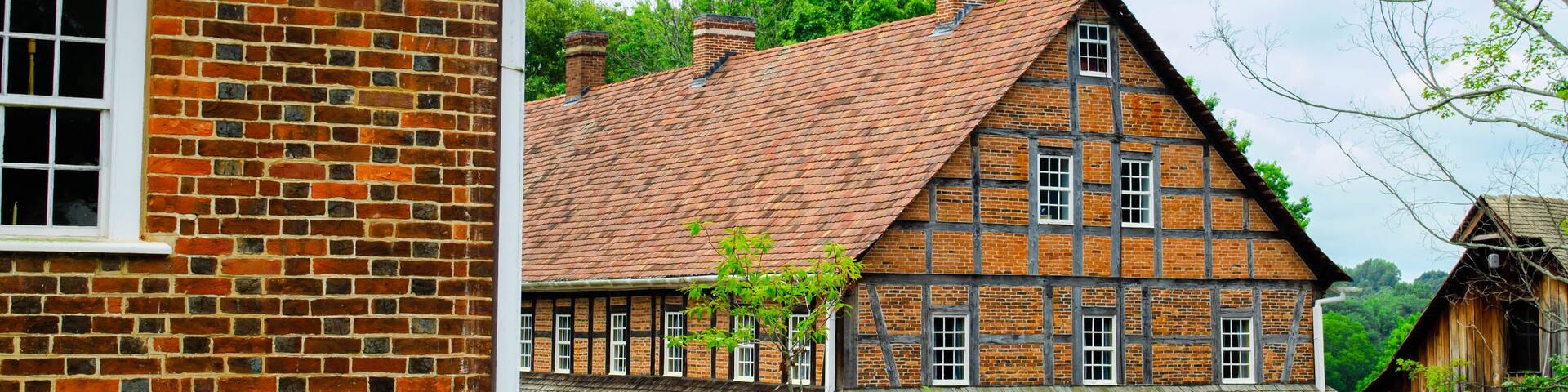 Multiple vintage timber frame and brick buildings in a small town