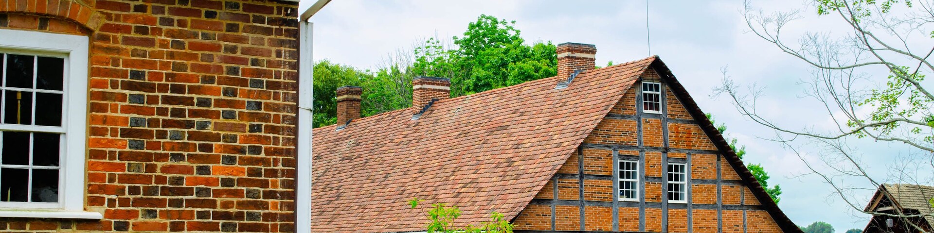 Multiple vintage timber frame and brick buildings in a small town