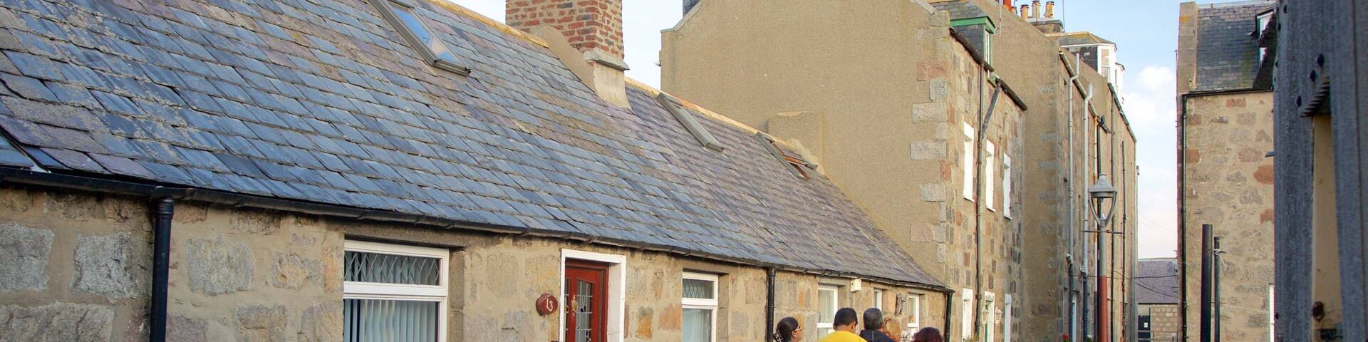 Aberdeen which includes street scenes as well as a small group of people