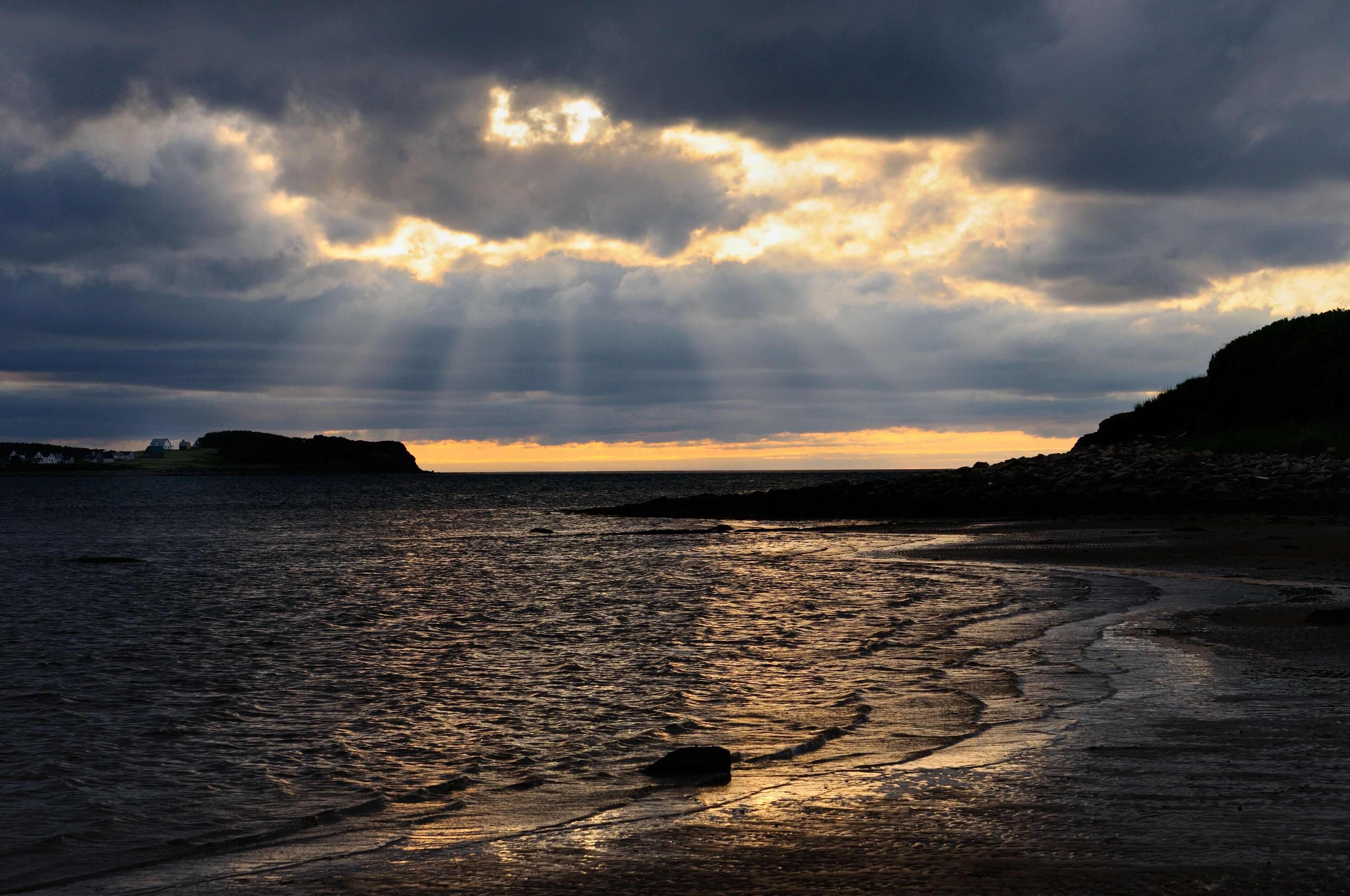 Shafts of sunlight at Port Hood shores Cape Breton Island Nova Scotia