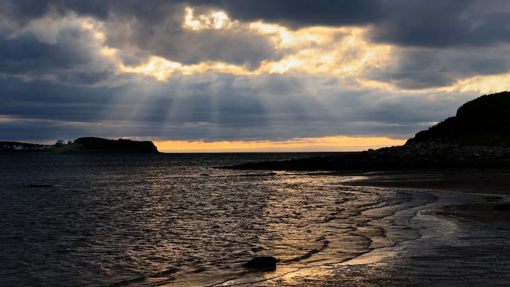 Shafts of sunlight at Port Hood shores Cape Breton Island Nova Scotia