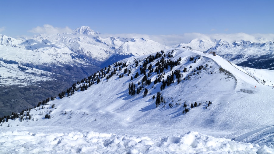 Ski slopes on a hill with snowy, mountain peaks in the background, La Plagne, Alps, France, Shutterstock ID 529943059, Purchase Order: -
