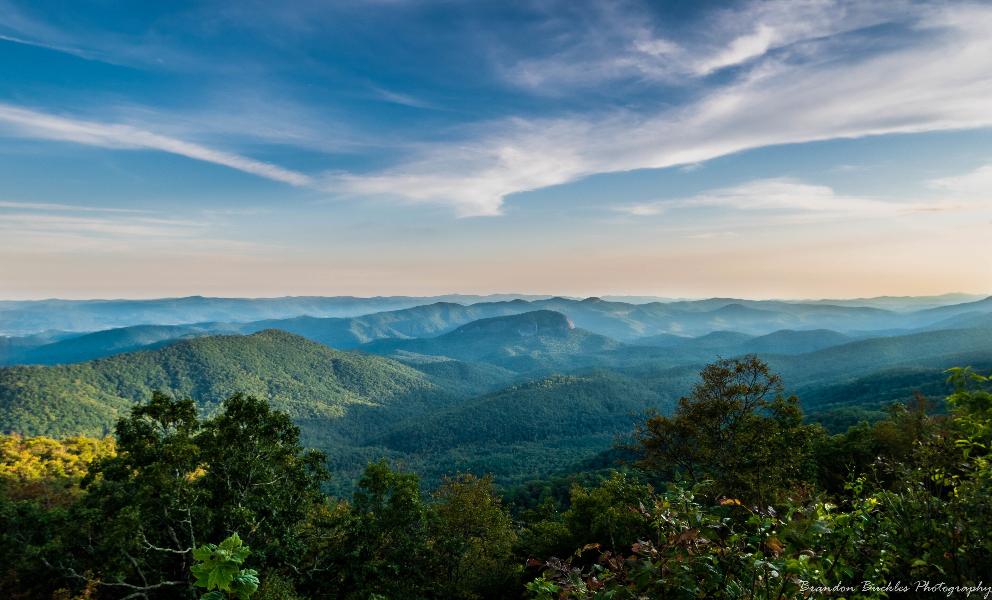 The sun sets on Looking Glass Rock, nestled in the Blue Ridge Mountains in Brevard, NC. View from Blue Ridge Parkway.

#MyBackyard
#lookingglass
#blueridgeparkway
#blueridgemountains
#brevard
#northcarolina
#sunset