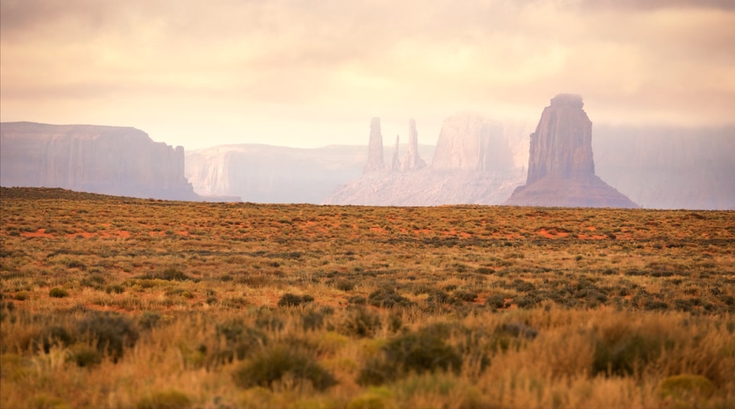 Monument Valley which includes a gorge or canyon, a sunset and tranquil scenes