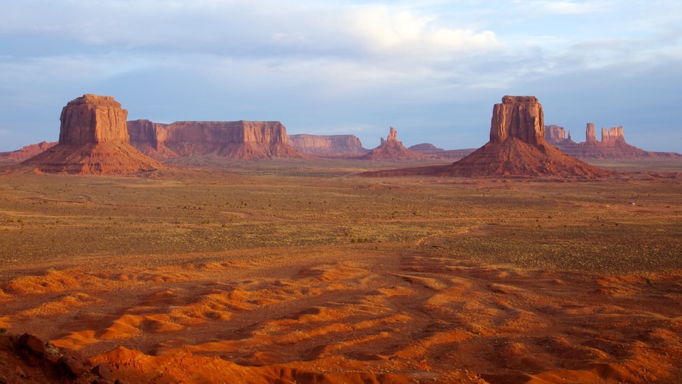 A desert landscape with prominent rock formations.