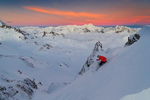 Val-d\'Isere featuring a sunset, snow skiing and snow