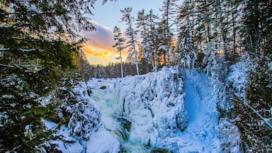 Winter wonderland at the frozen Dorwin Falls in Rawdon, Québec, Canada - Natural winter landscape of a narrow canyon going through a maple forest covered with snow