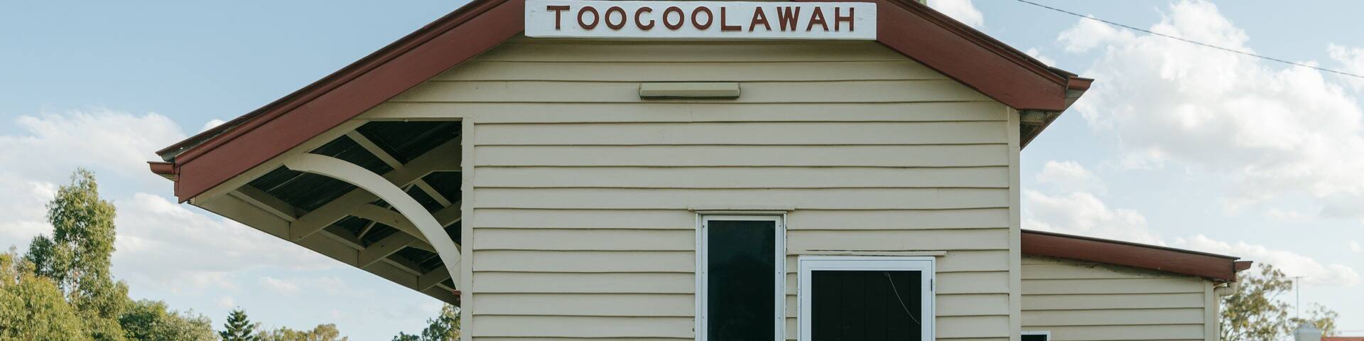 Toogoolawah which includes signage and a small town or village