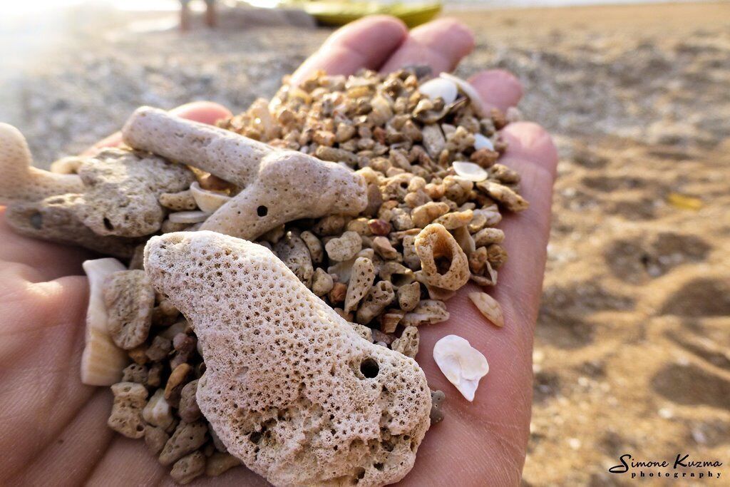 An old man lived here, a hermit, for over 50 years - he let no one on "his" beach. He's gone now, and you can now watch the best sunsets from this stretch of coral beach.