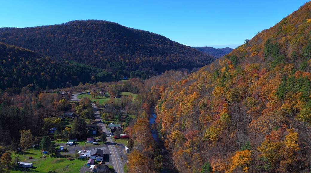 Countryside with Mountains in Autumn Fall colors with houses in grassy valley in Pennsylvania near Morris, PA