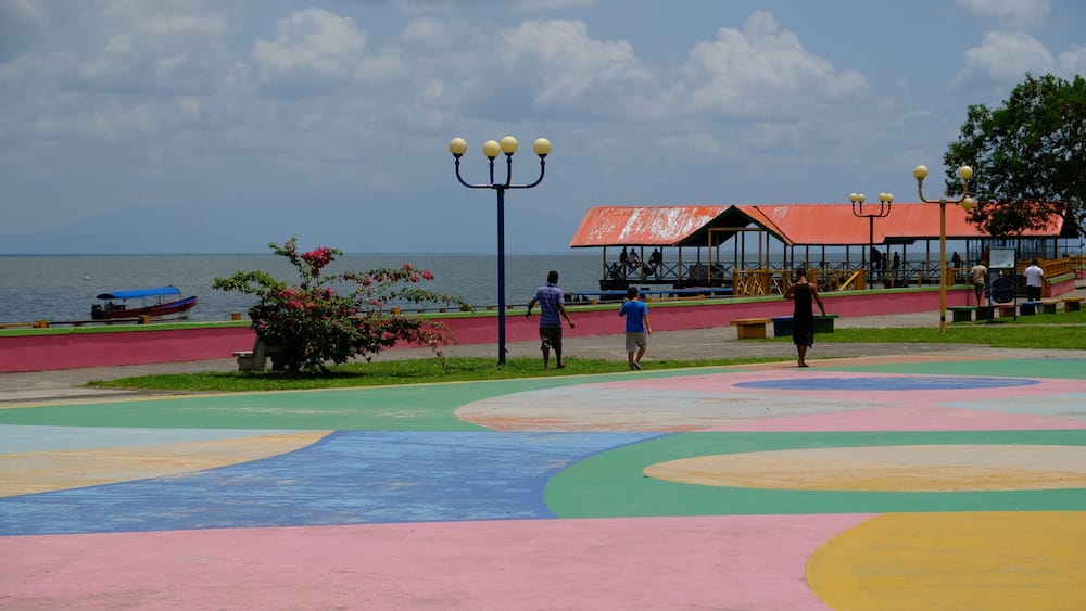 A colorful playground with a view of the sea.