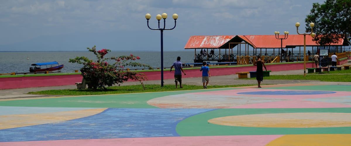 A colorful playground with a view of the sea.