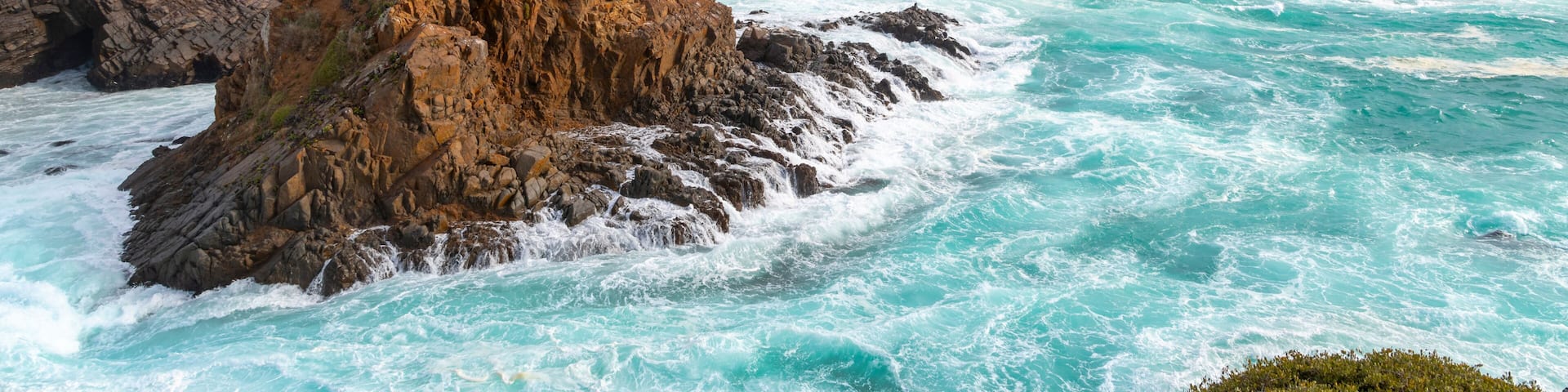 The rocky, scenic coastline along the Pacific Ocean at the cape of Punta Banda, southwest of the city of Ensenada, Mexico.