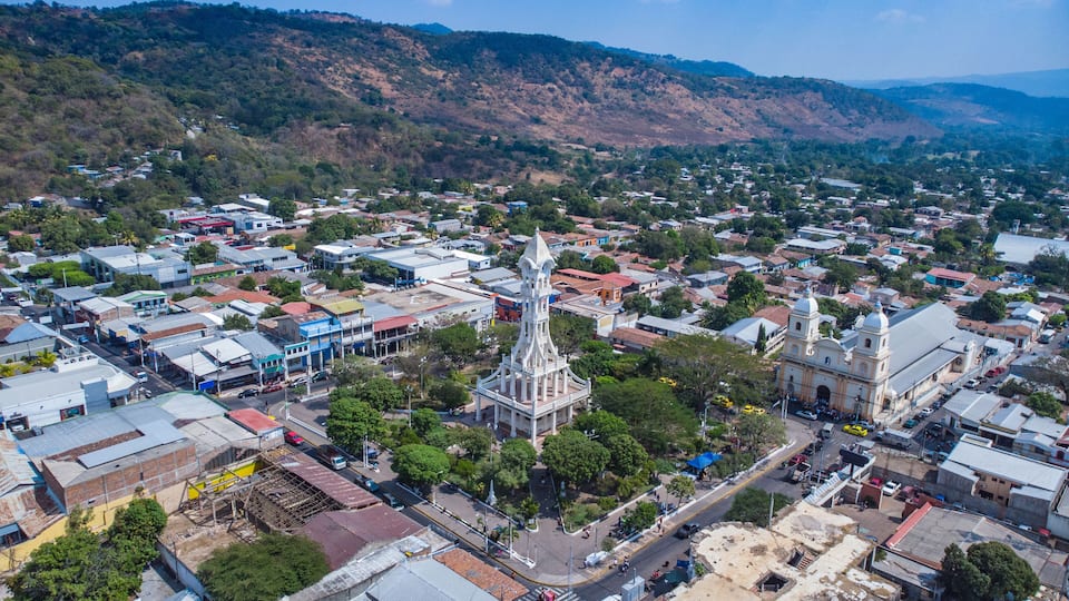 Aerial view of Cañas Square in San Vicente, El Salvador, where you can see some trees and their tower right in the middle.