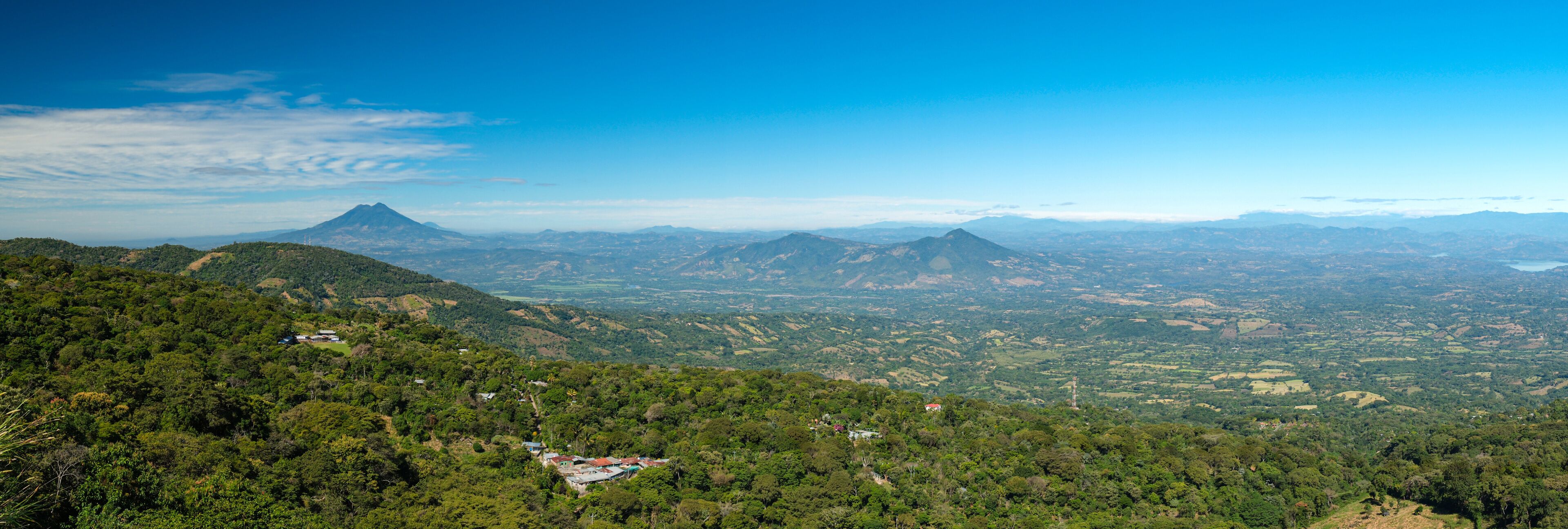 Panoramic wide angle view of San Vicente volcano from a lookout located between small towns Berlin and Alegria in El Salvador. Sunny day, blue sky.