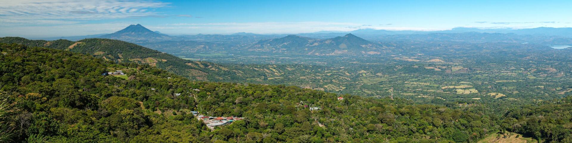 Panoramic wide angle view of San Vicente volcano from a lookout located between small towns Berlin and Alegria in El Salvador. Sunny day, blue sky.