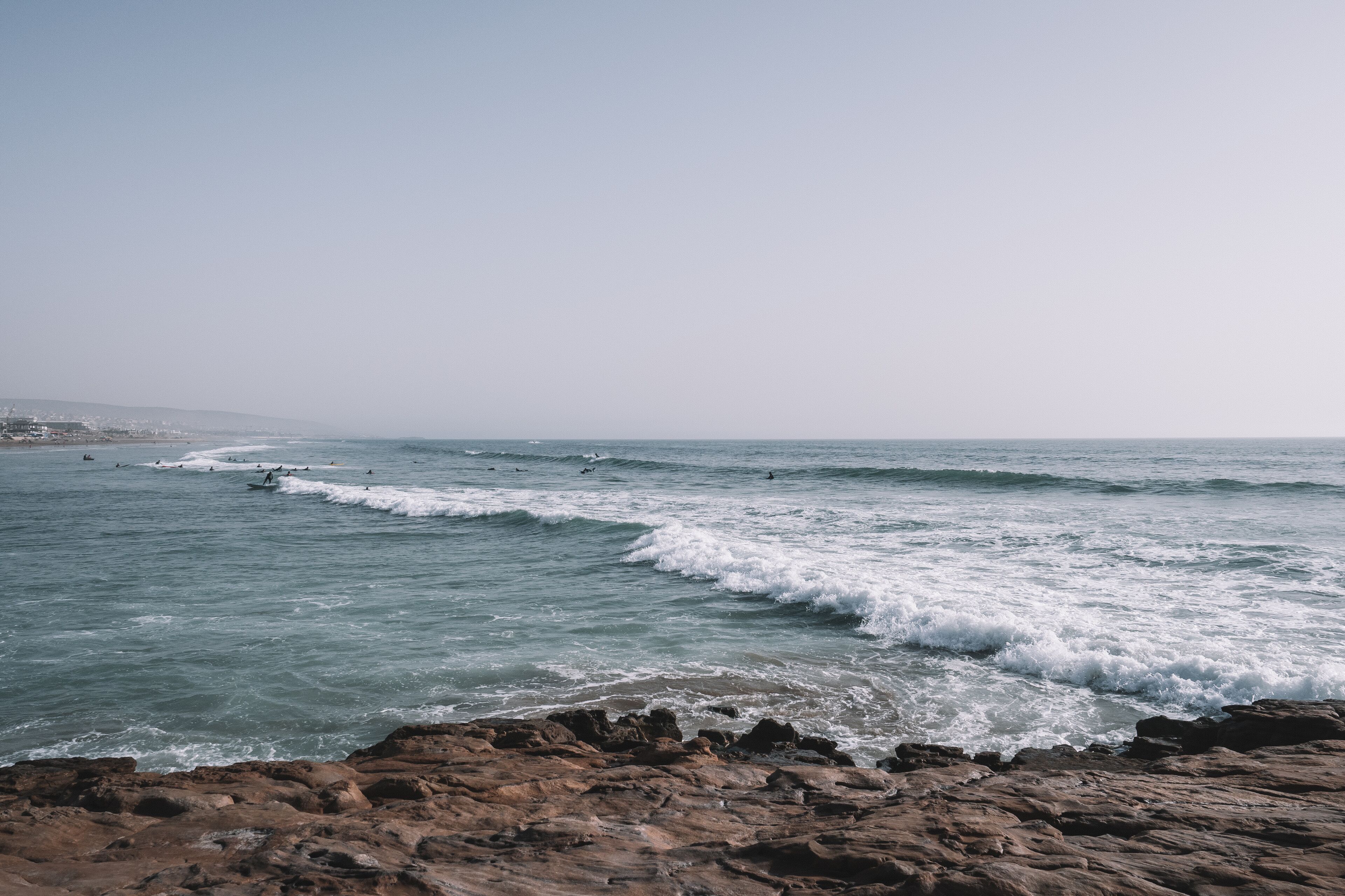 Surfers surfing the Waves of Taghazout at the West Coast of Morocco, Africa