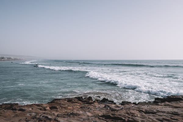 Surfers surfing the Waves of Taghazout at the West Coast of Morocco, Africa