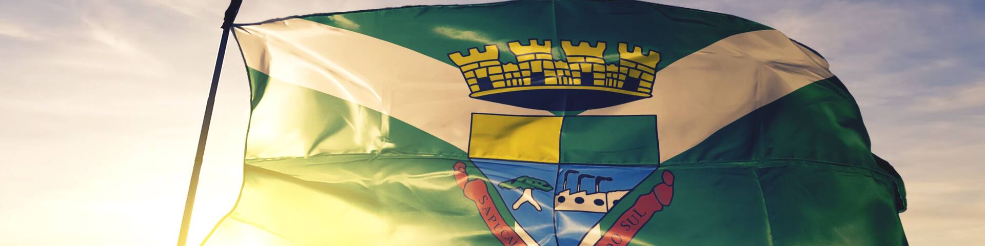 Sapucaia do Sul of Brazil flag waving on the top sunrise mist fog