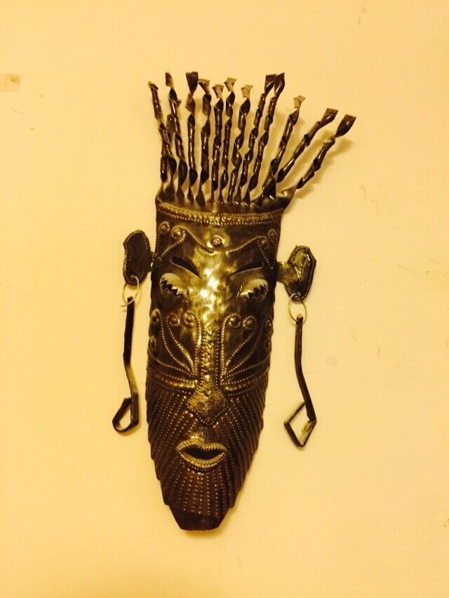 There has been a thriving fer decoupé (metal sculpture) industry in Haiti for nearly 60 years.  The industry is primarily situated in the artistic village of Noailles, in the Croix des Bouquets area.  Much of the art work is based upon the Haitian tradition of Voodoo.  The metal typically comes from used drums. The unique sculptures can take many forms and styles from the one you see to light-hearted painted lizards. 