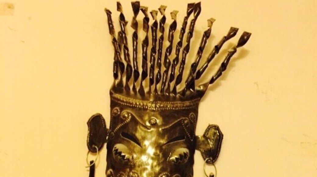 There has been a thriving fer decoupé (metal sculpture) industry in Haiti for nearly 60 years. The industry is primarily situated in the artistic village of Noailles, in the Croix des Bouquets area. Much of the art work is based upon the Haitian tradition of Voodoo. The metal typically comes from used drums. The unique sculptures can take many forms and styles from the one you see to light-hearted painted lizards.