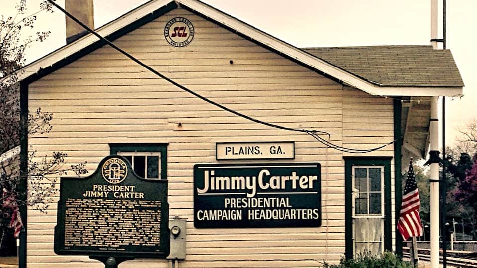 A small building labeled "Jimmy Carter Presidential Campaign Headquarters" in Plains, GA.