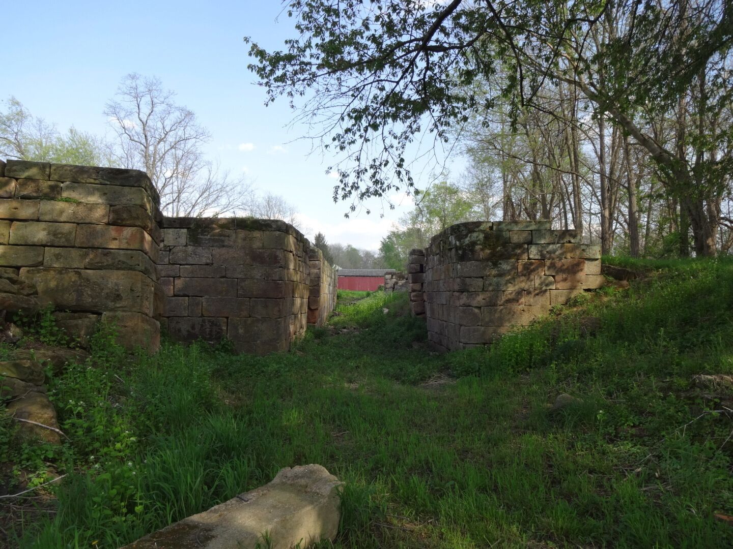 Lockville Canal Park is a 7 acre green space that contains three intact locks that once made up part of the central section of the Ohio and Erie Canal, a 308-mile highway of water that connected Lake Erie at Cleveland to the Ohio River at Portsmouth.

Construction on the locks began on July 4th, 1825 and took over seven years to complete. The canal system propelled Ohio's economy from last in the nation to nearly first in just a few years.

Seen in the background is Hartman Number 2 Covered Bridge, a late nineteenth-century covered bridge featuring a queenpost truss, shake roofing and red plank siding.