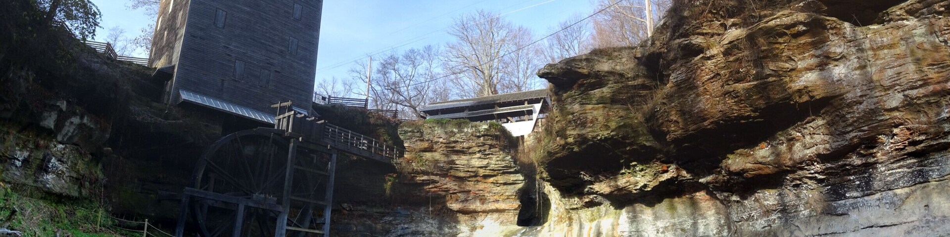 Rock Mill Park encompasses the historic Rock Mill, a stunning grist mill built in 1824 above the Hocking River Falls and the scenic Rock Mill Covered Bridge, constructed in 1901.
Standing 90 feet above the gorge of the falls, Rock Mill was one of a dozen mills in the area whose power source was the Hocking River. The mill was in operation grinding flour and corn into wheat and meal as late at 1905.