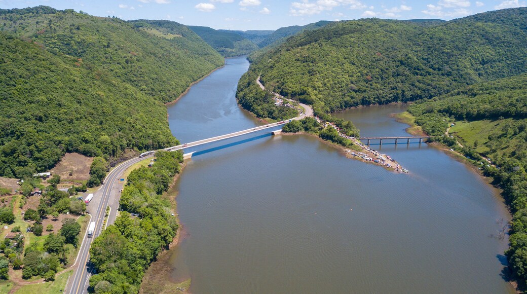 Aerial view of the Pelotas River bridge with its green mountains. Border between Rio Grande do Sul and Santa Catarina, Brazil