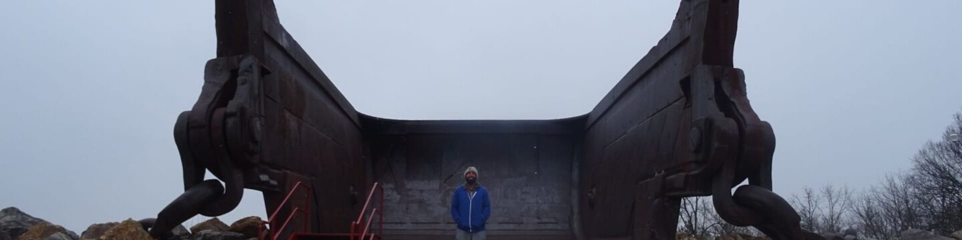 This giant bucket is all that remains of Big Muskie.
Big Muskie was a coal-mining dragline excavator, longer than a football field, weighing 12,200  tons and standing nearly 22 stories tall. It operated in southeastern Ohio from 1969 to 1991.
It was the largest machine ever to move on land. 
The 220 cubic yard bucket could hold two full size buses.