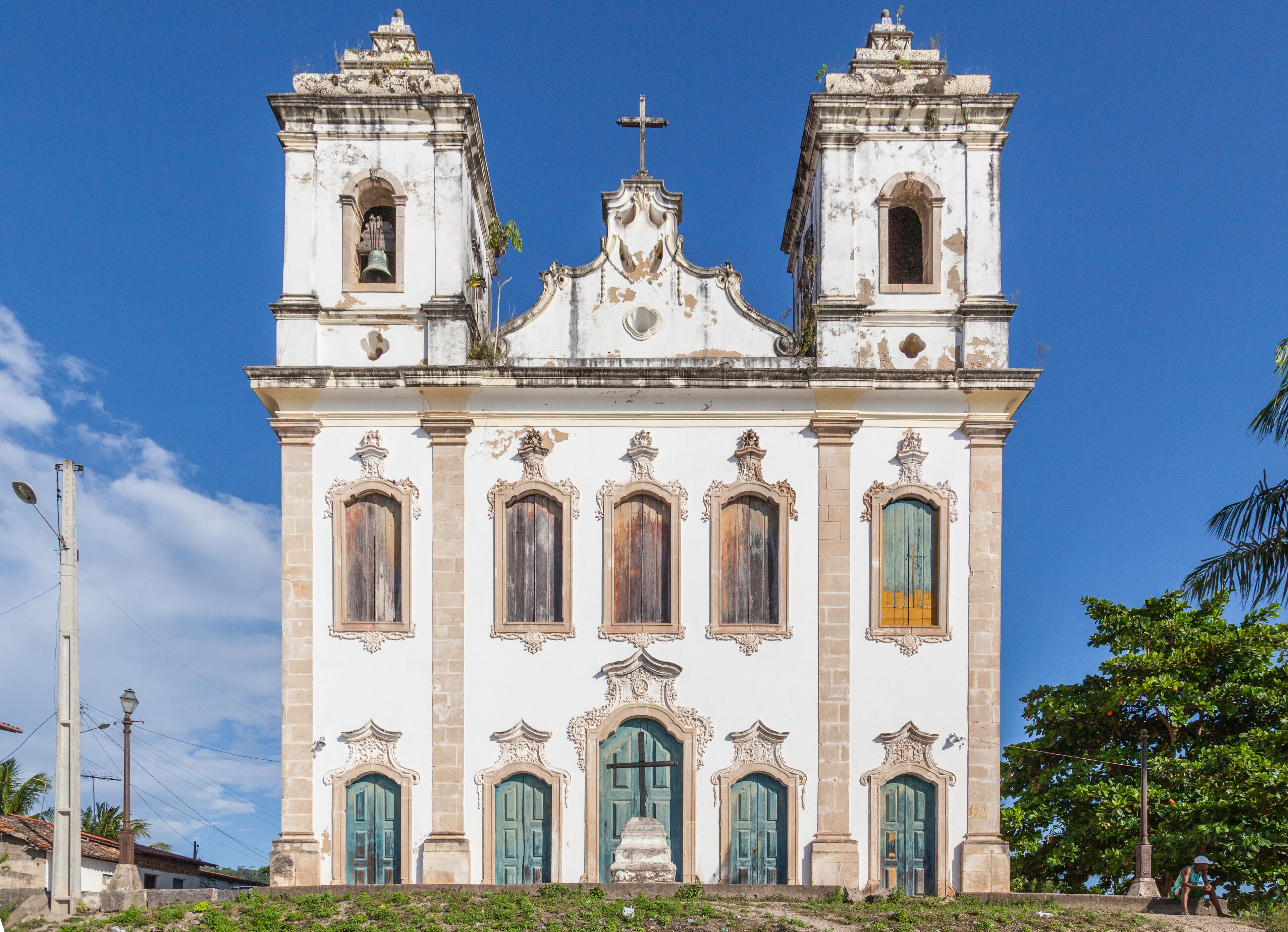 A historic church with two bell towers and ornate windows.