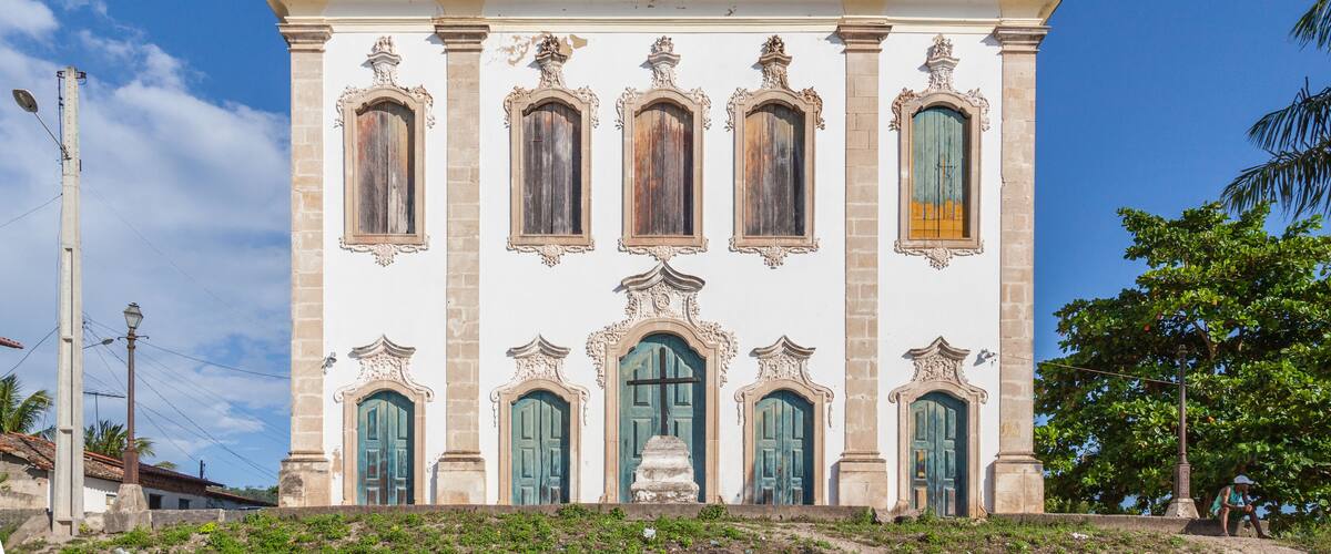 A historic church with two bell towers and ornate windows.