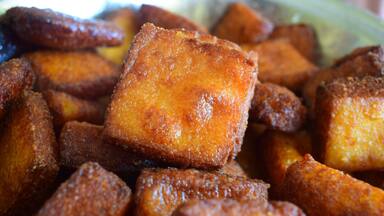 A close-up of fried dough pastries.