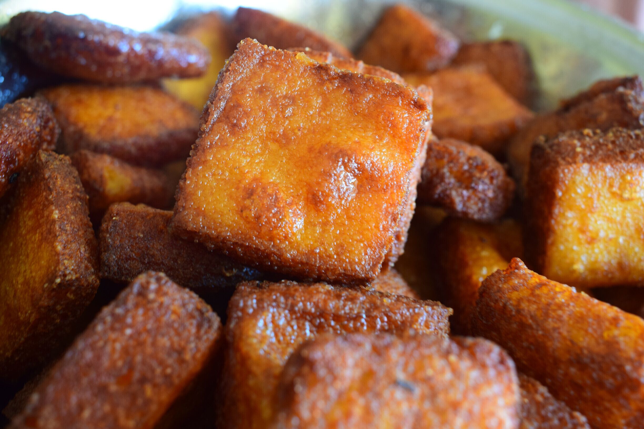 A close-up of fried dough pastries.