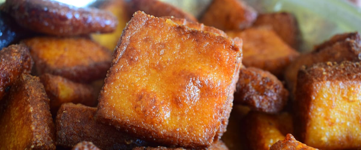 A close-up of fried dough pastries.