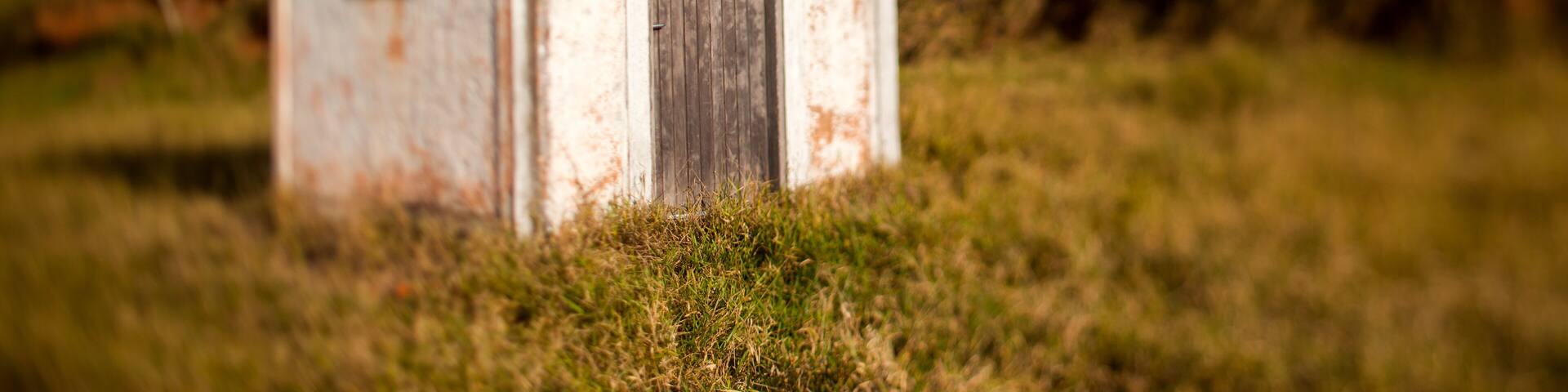 Small old white church in the countryside in a blue sky day - titl-shift lens