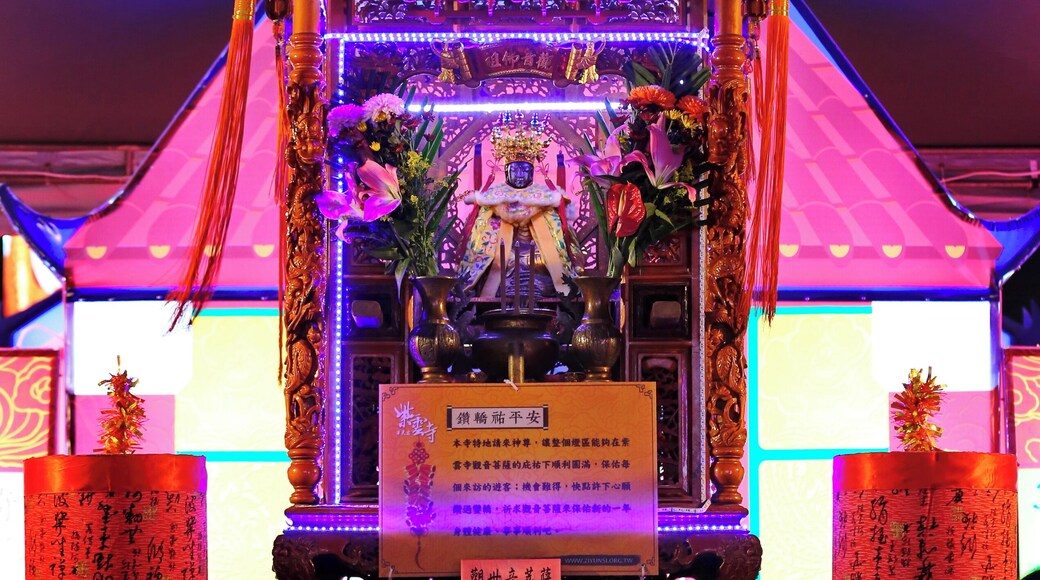 Worshipers crawling beneath the divine palanquin at the Chiayi Lantern Festival, Taiwan.