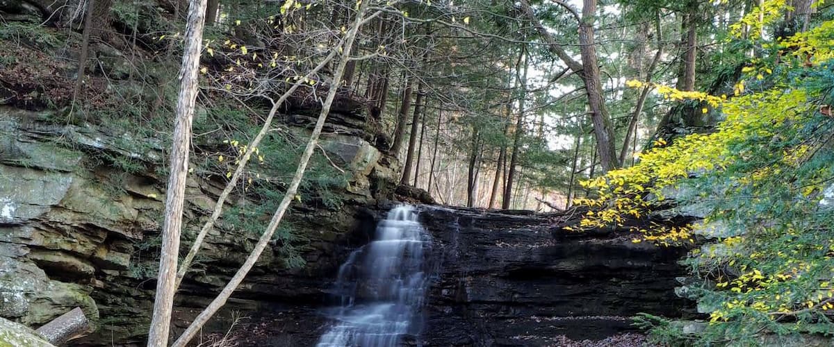 Honey Run Park would probably be considered a pocket park by a rural scale.
Honey Run is a park named after a waterfall named after a creek.
Honey Run Falls is a 20 ft tall waterfall that empties into the nearby Kokosing River. The flow over the falls varies greatly throughout the seasons.
The park also has a loop trail located across the road from the falls.
#Trovember