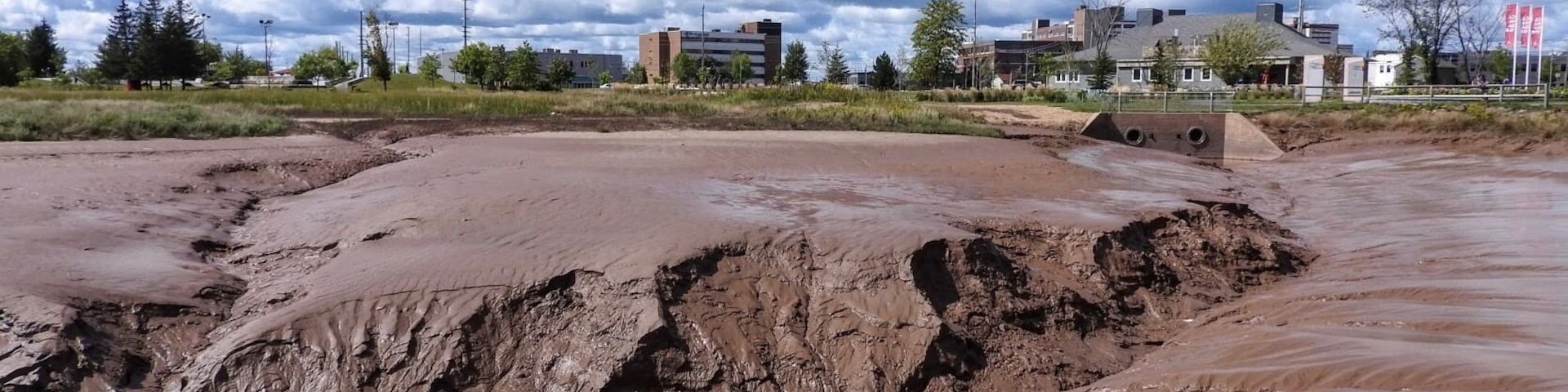 The Petitcodiac River, nicknamed locally as the Chocolate River because of its brown colour thanks to all of the silt. This photo taken at low tide. (September 2019)