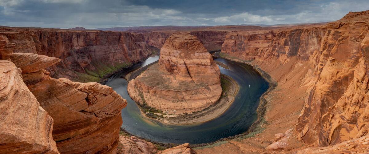 A canyon with a river winding through it.