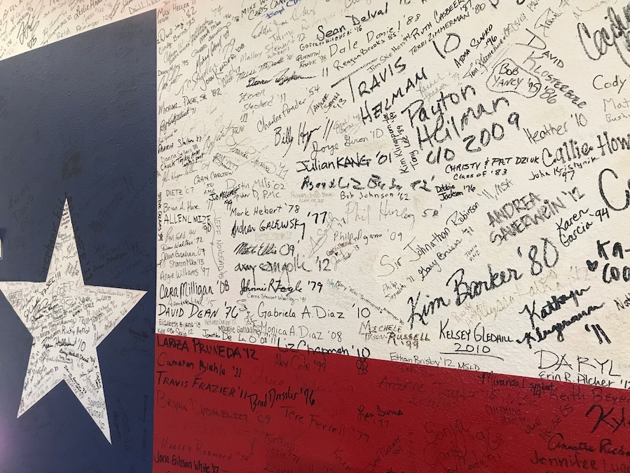 a lot of signatures on the wall