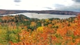 A lake surrounded by autumn foliage.